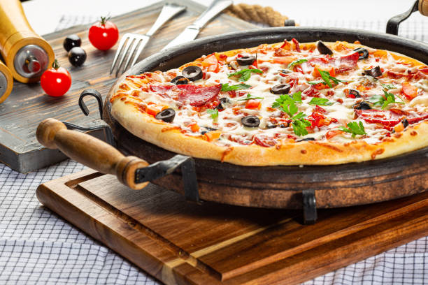 istock whole italian pizza in a pan, decorated 1351315322