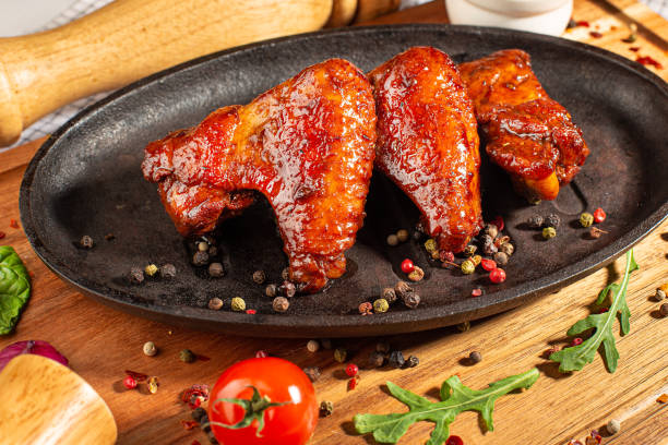 istock Grilled chicken wings on a pan 1351315420