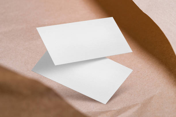 istock Clean minimal business card mockup on craft paper with shadow 1351316268
