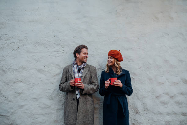 istock Happy Couple Having Fun while Drinking Mulled Wine Outdoors 1351316752