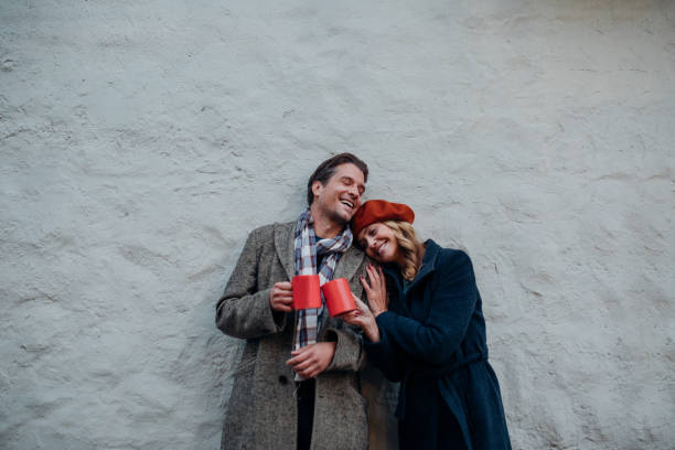 istock Happy Couple Having Fun while Drinking Mulled Wine Outdoors 1351316761