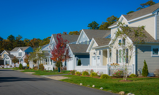 A well landscaped neighborhood of new homes in southern New England