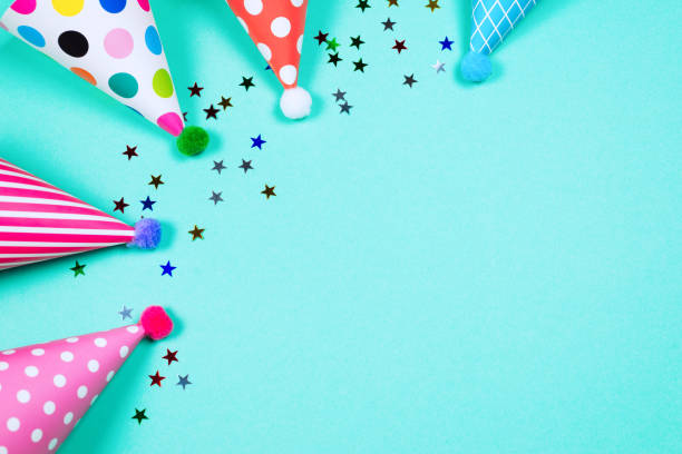 istock Colorful birthday caps on a blue background. Top view. 1351318002