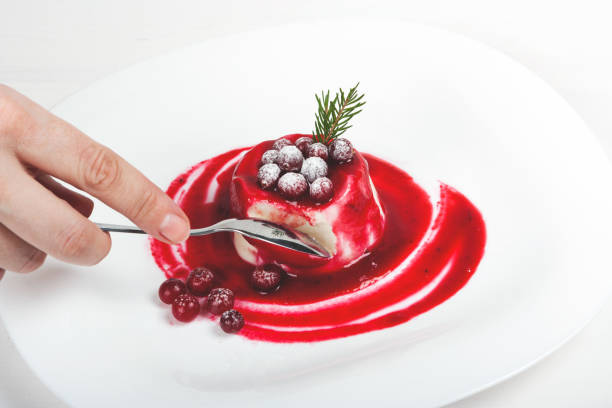 Flan - delicious creme dessert with caramel sauce.French creme caramel dessert or flan with strawberry and mint,  on the wooden background