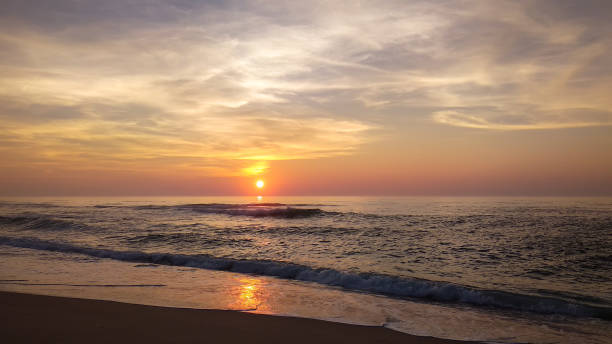 istock Sunset over the calm Atlantic Ocean in warm tones 1351319480