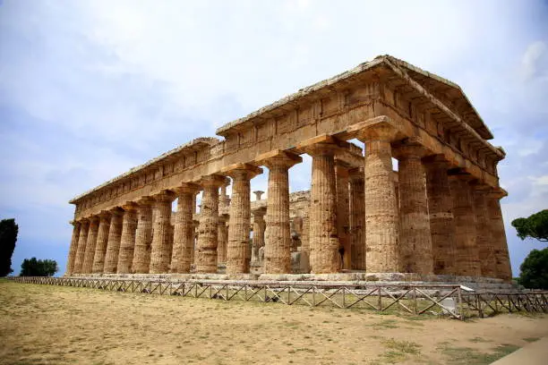 The majestic structure of the temple of Neptune against a blue sky, excavations of Paestum, Cilento, Campania, Italy