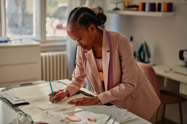 istock Young fashion designer sketching in her studio 1351320864