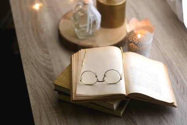 istock Books, Glasses and Candles 1351322312