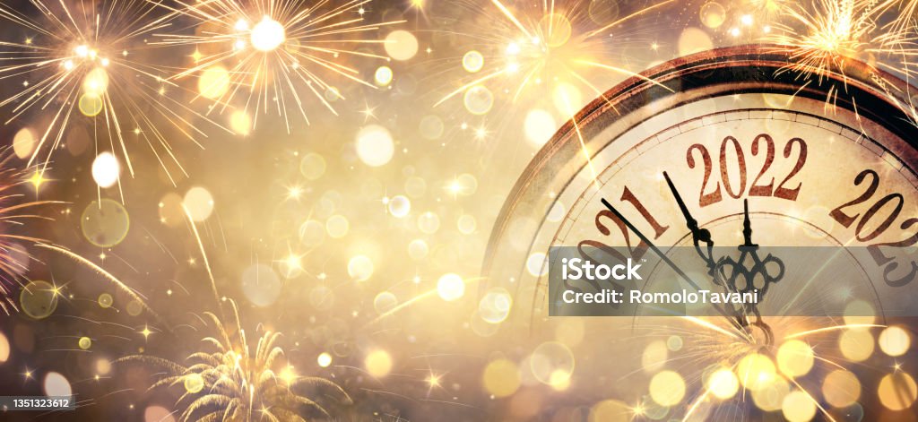 2022 New Year - Clock And Fireworks - Countdown To Midnight  - Abstract Defocused Background Happy New Year's Eve - Vintage Clock With Golden Bokeh New Year Stock Photo