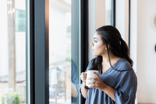 istock Stay at home mom relaxes with coffee in morning 1351328675