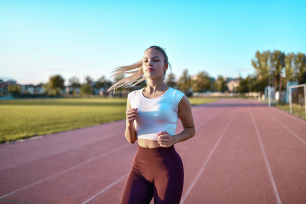istock Jogging Time For Blond Female Beauty On Track 1351329293