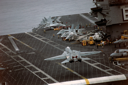 Aerial view of naval ship travelling in San Diego Bay, San Diego, California, USA.