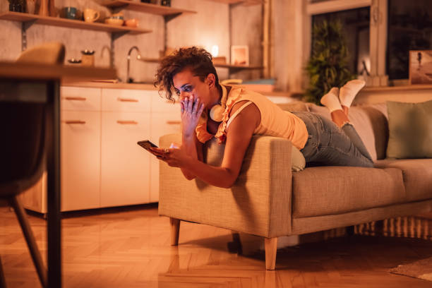 istock Woman surprised by a phone message 1351330537