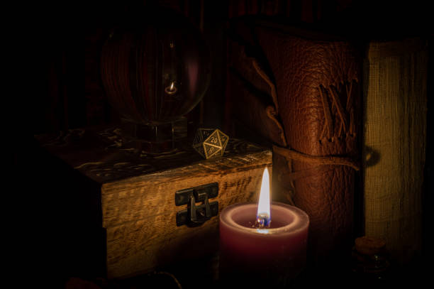 istock Metallic d20 on a wooden box in candlelight 1351330729