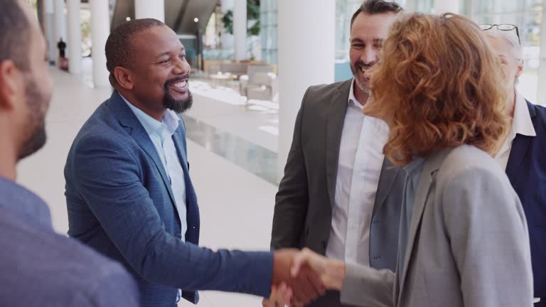 Business people shaking hands in meeting