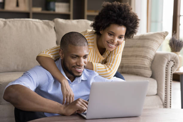 istock Happy young african american couple using computer. 1351333937