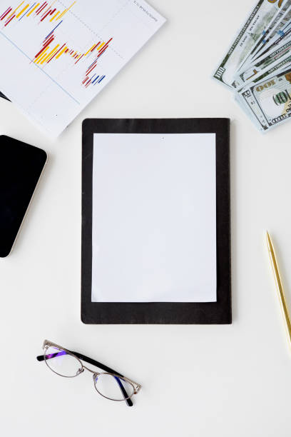 istock There is a white sheet of mockup paper blank on the table. 1351334177