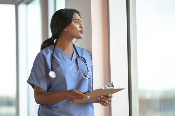 istock Doctor Pausing in the Hallway 1351335468