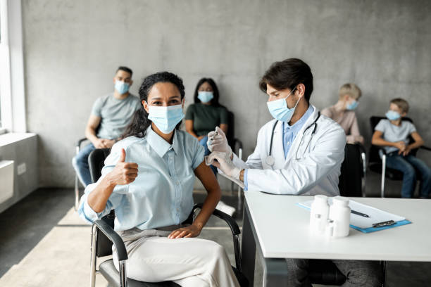 istock Middle-eastern lady getting vaccinated against coronavirus at clinic 1351336324