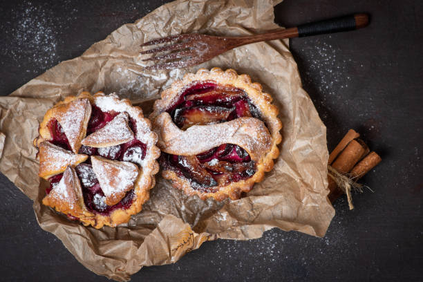 istock Mini pies with seasonal fruit - plums, cherries, grapes 1351336641