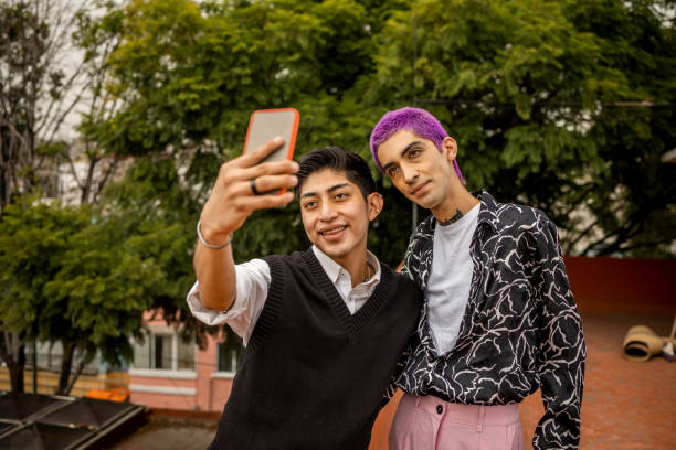 istock Young gay couple taking selfie 1351342418