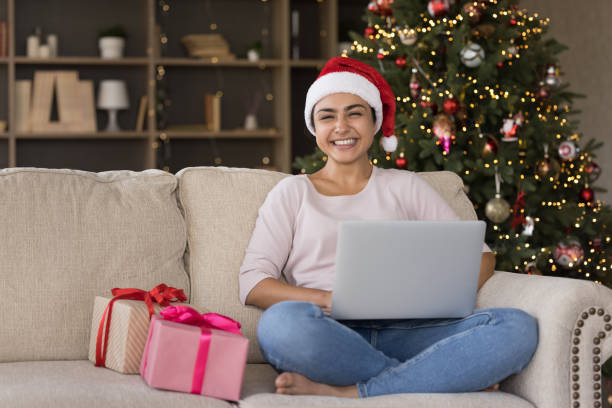 istock Happy millennial Indian woman using computer at home. 1351343452
