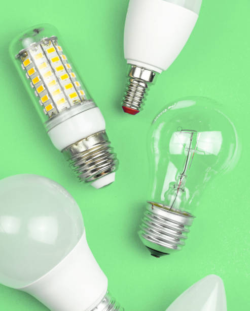 istock Different kinds of light bulbs together, eco green background. Energy saving concept. Flat lay, top view photo 1351345030