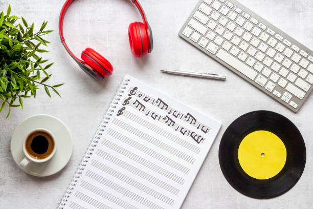 istock Compose music concept with music sheets and headphones, top view 1351346661