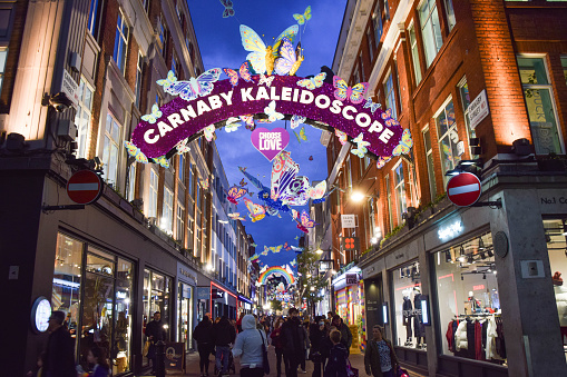 London, UK - November 4 2021: Christmas decorations in the iconic Carnaby Street at night.