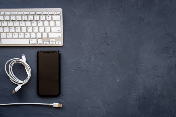 istock Charging cable for mobile phone or laptop, top view 1351348833