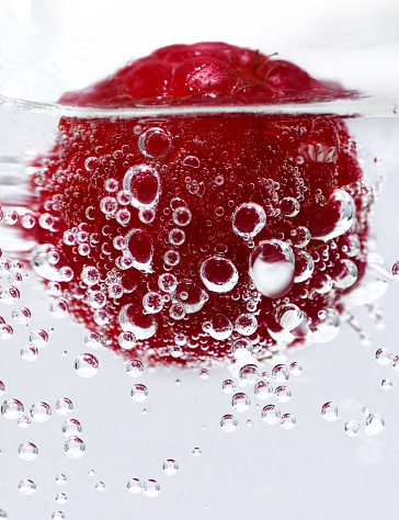 Red berry in water splash
