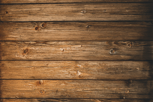 Abstract brown wood background texture. Vintage wooden dark horizontal boards. Wooden old wall. Top view.