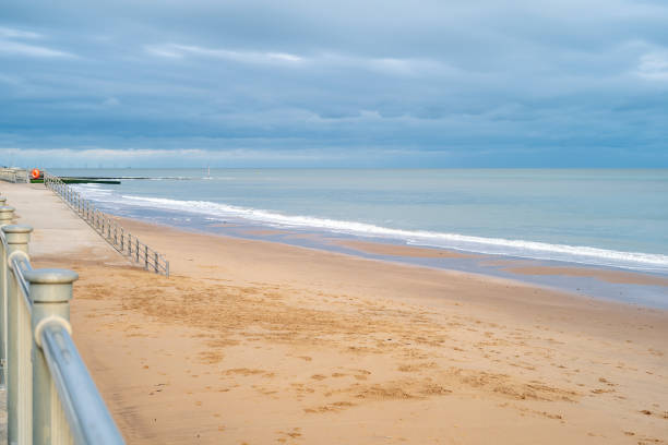 Gentle white surf on Ramsgate main sands. There is nobody on the beach on an autumn day. Gentle white surf on Ramsgate main sands. There is nobody on the beach on an autumn day. ramsgate stock pictures, royalty-free photos & images