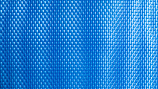Nylon blue texture. Dark polyester fiber material for sport cloth or abstract weave background. Carbon pattern for wallpaper, graphic design