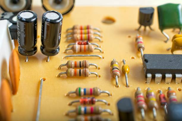 istock Close-up printed circuit board with discrete diodes resistors integrated circuit chip 1351360476