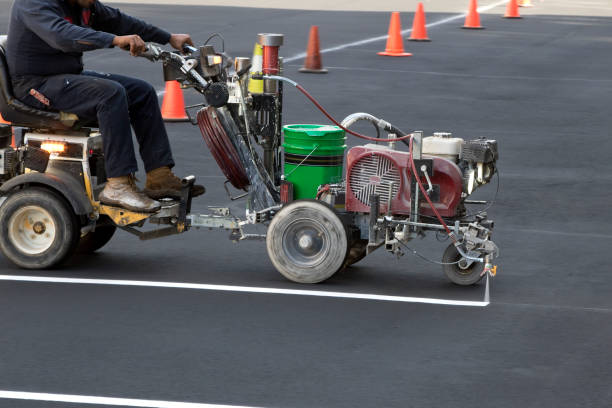istock Marking machine worker painting parking lot lines 1351362674