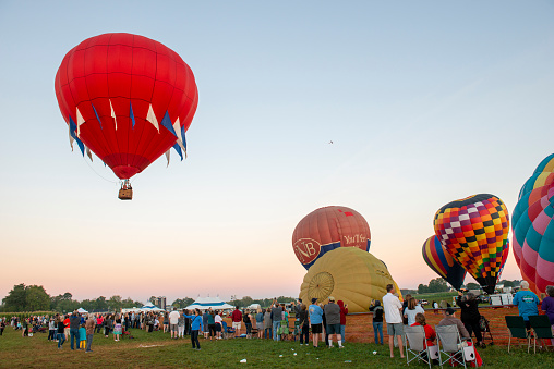 Albuquerque, New Mexico - USA - Oct 8, 2023: Several hot air balloons preparing to launch at the Albuquerque International Balloon Fiesta