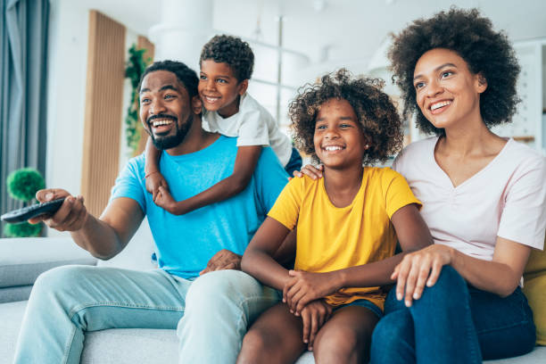 istock Family watching television 1351366137