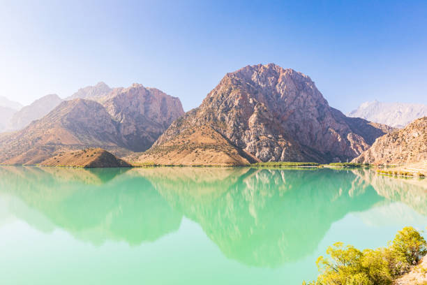 istock Mountains and blue sky above Iskanderkul Lake. 1351367295