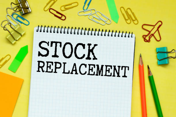 istock Handwritten text Stock Replacement with fountain pen on notebook. Concept image with copy space available. 1351369396