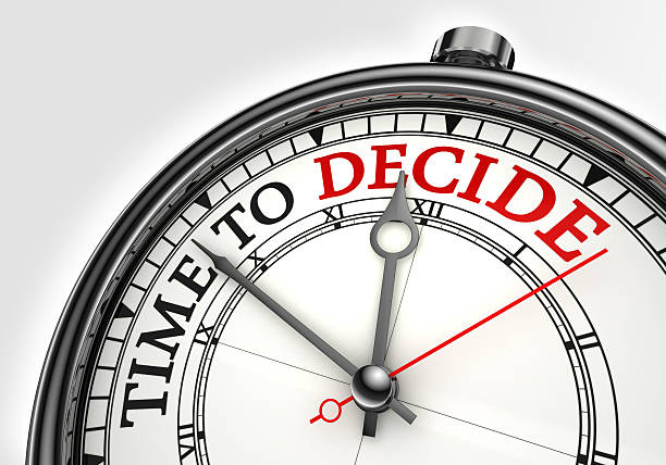 time to decide concept clock stock photo