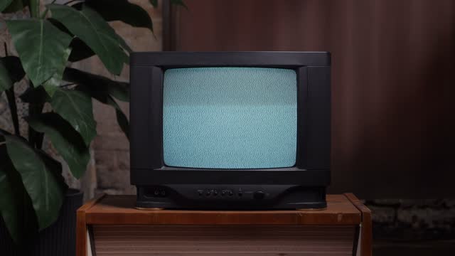 Home interior old television set. Bad television signal noise. 90s retro tv screen static noise. Living room old tv set. Analog static effect retro tv room interior. Television in retro interior home