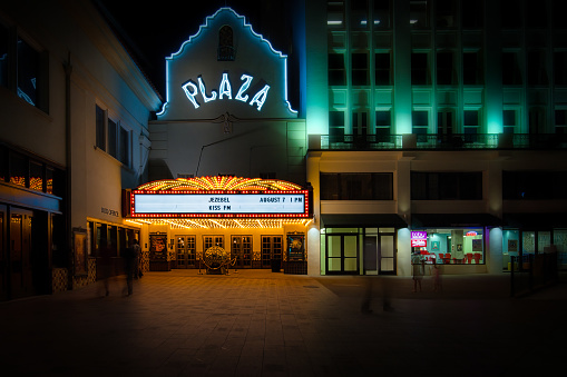 El Paso, Texas, USA - August 6, 2015: People walking on a summer evening in 2015 by the lights of the Plaza Theatre.