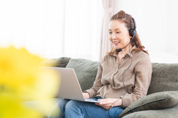 istock senior age woman studying with a PC,correspondence course 1351382277