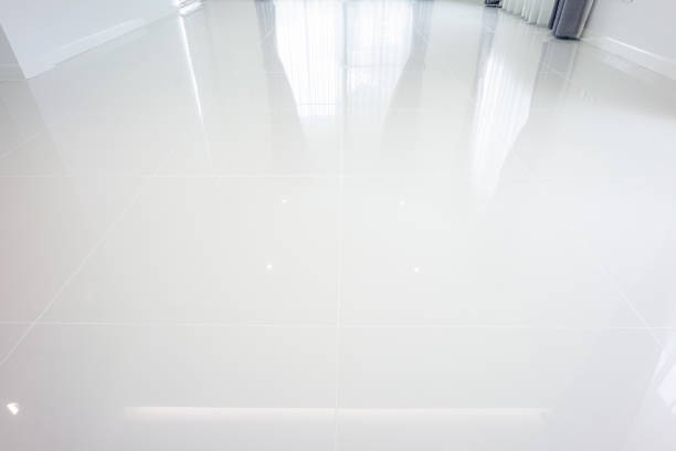 istock White tile floor in perspective view for background. 1351387054