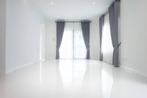 istock White empty room and tile floor in perspective view for background. 1351387056