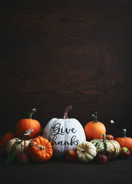 istock Thanksgiving Arrangement with Assorted Pumpkins and GIVE THANKS Message 1351387215
