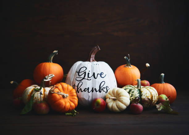 istock Thanksgiving Arrangement with Assorted Pumpkins and GIVE THANKS Message 1351387233