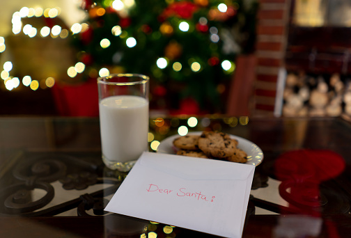 Christmas letter, cookies and a glass of milk waiting for Santa at a Latin American beautiful home - Christmas celebration concepts