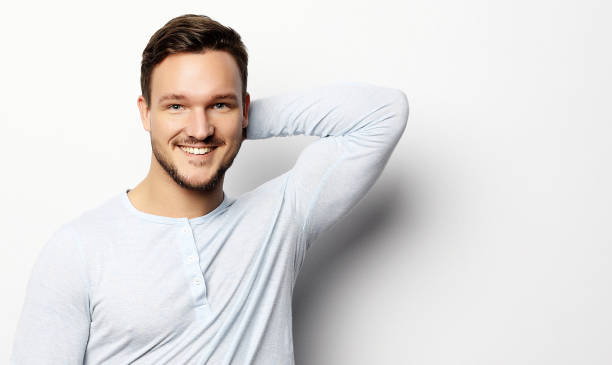istock Handsome young man in smart casual wear looking at camera 1351393059